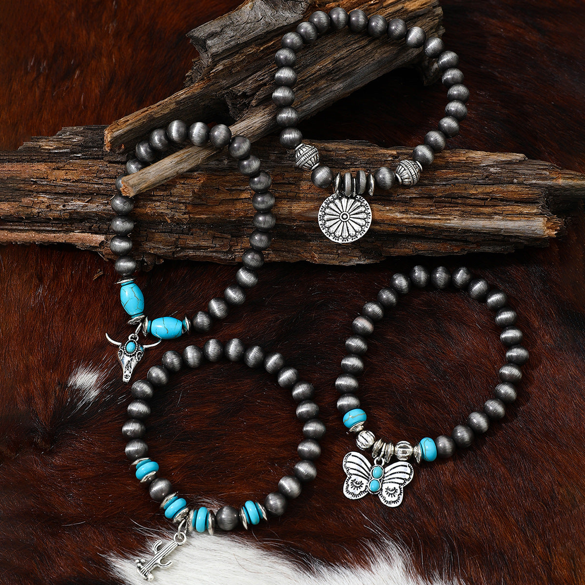 Wholesale Imitation pearl cactus butterfly bull head flower elastic bracelet